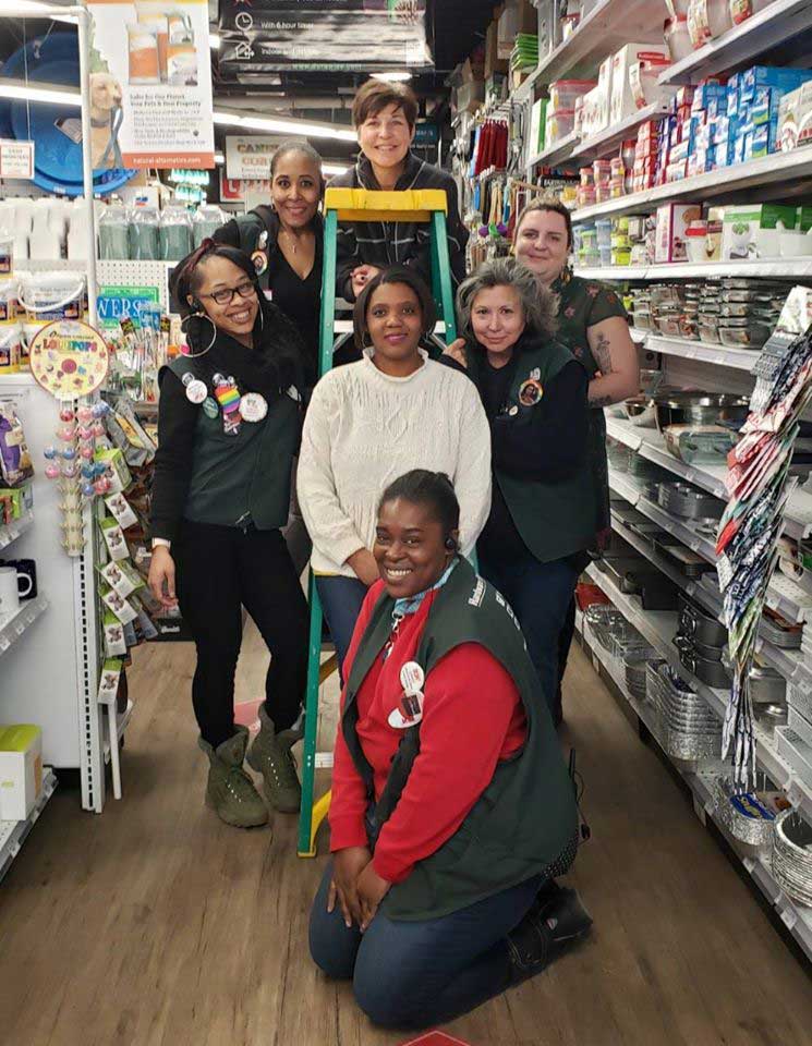 Gina Schaefer (back middle) celebrates International Women’s Day at Logan Hardware with key staff members.