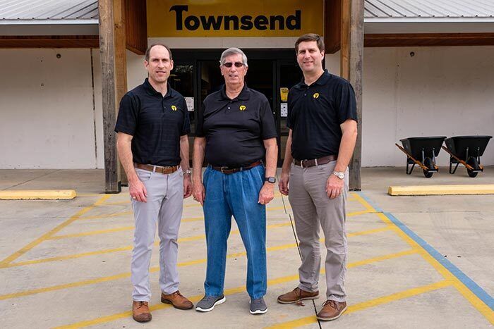 Michael (left) and Turner Townsend (right) took over Townsend Building Supply from their father, Dale (center), in 2012.